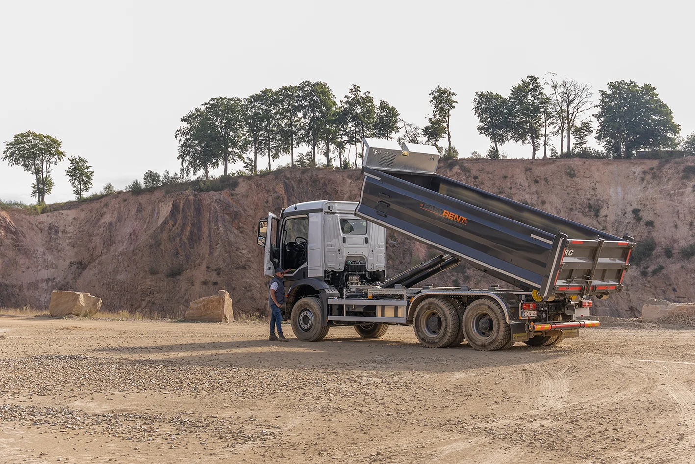 Abrollkipper mit Container